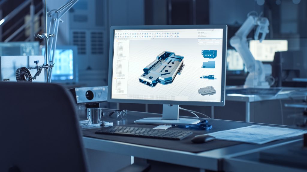 On the Desk Computer With CAD Software and Design of 3D Industrial Machinery Component.